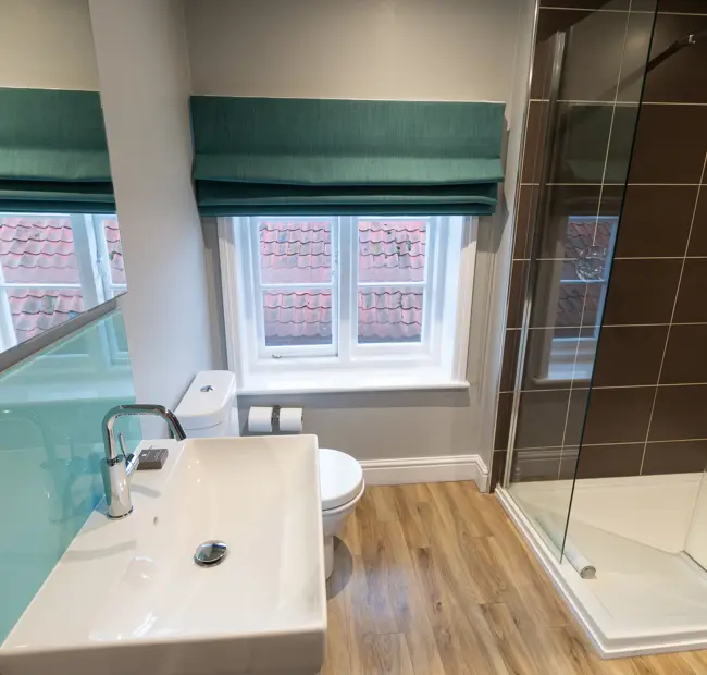 Deluxe Sea View room, bathroom sink and walk in shower
